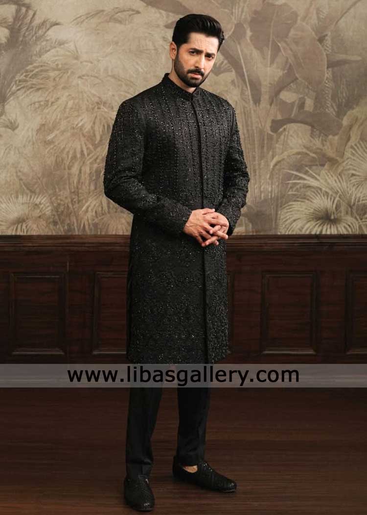 Black floral Mughal embroidery wedding sherwani for groom with hand embellishment with coordinated kurta trousers New York Illinois San Jose Black floral Mughal embroidery wedding sherwani for groom with hand embellishment with coordinated kurta trousers New York Illinois San Jose