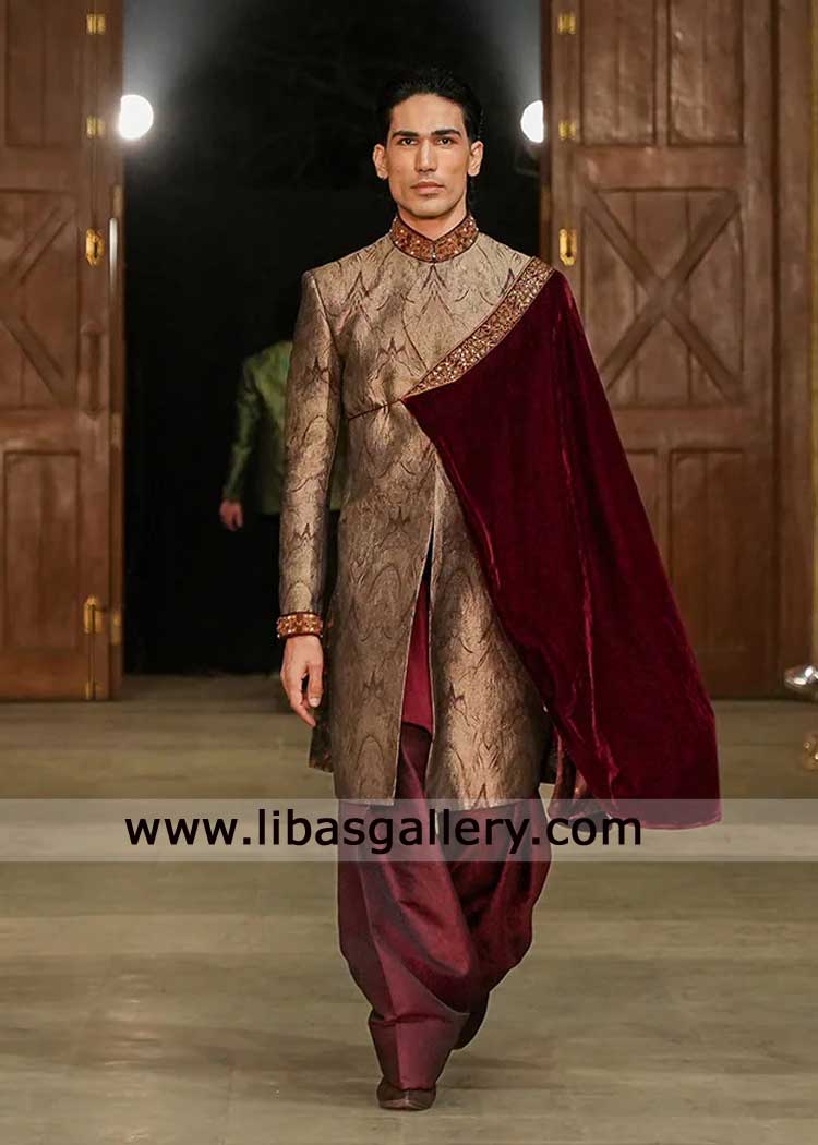 Maroon Jamawar groom wedding sherwani with gold hand work on collar cuff paired maroon kurta shalwar and side cloak UK USA Canada Dubai Maroon Jamawar groom wedding sherwani with gold hand work on collar cuff paired maroon kurta shalwar and side cloak UK USA Canada Dubai