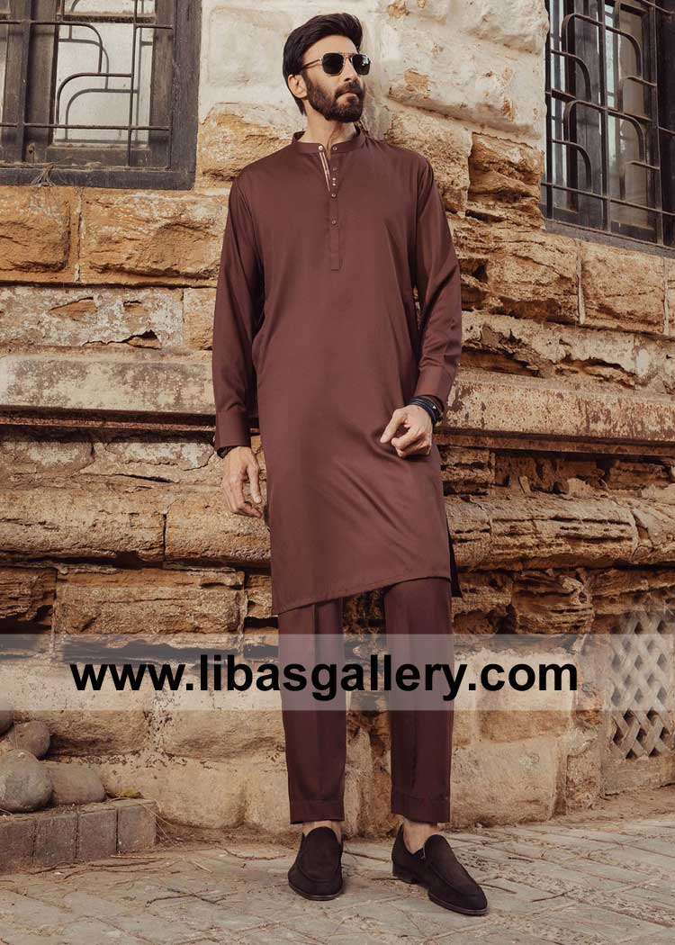 Men Eid Kurta with Cuff Style Sleeves and Pajama Aijaz Aslam standing with Wall buy online kurta trouser fast delivery Sweden Spain France