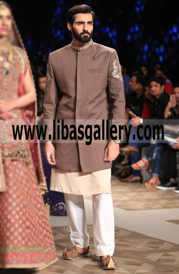 hasnain lehri famous model showing in designer groom sherwani style upper knee length paired with cream kurta white pajama inner singapore south africa asia europe