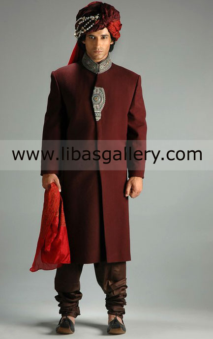 skinny groom standing in maroon wedding sherwani gray silver nice work Rome Venice italy 