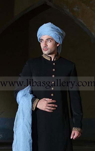 Fair complexion groom standing outside Mosque after nikah in Black Sherwani jacket sky blue turban pre tied Qatar Saudi Arabia Kuwait