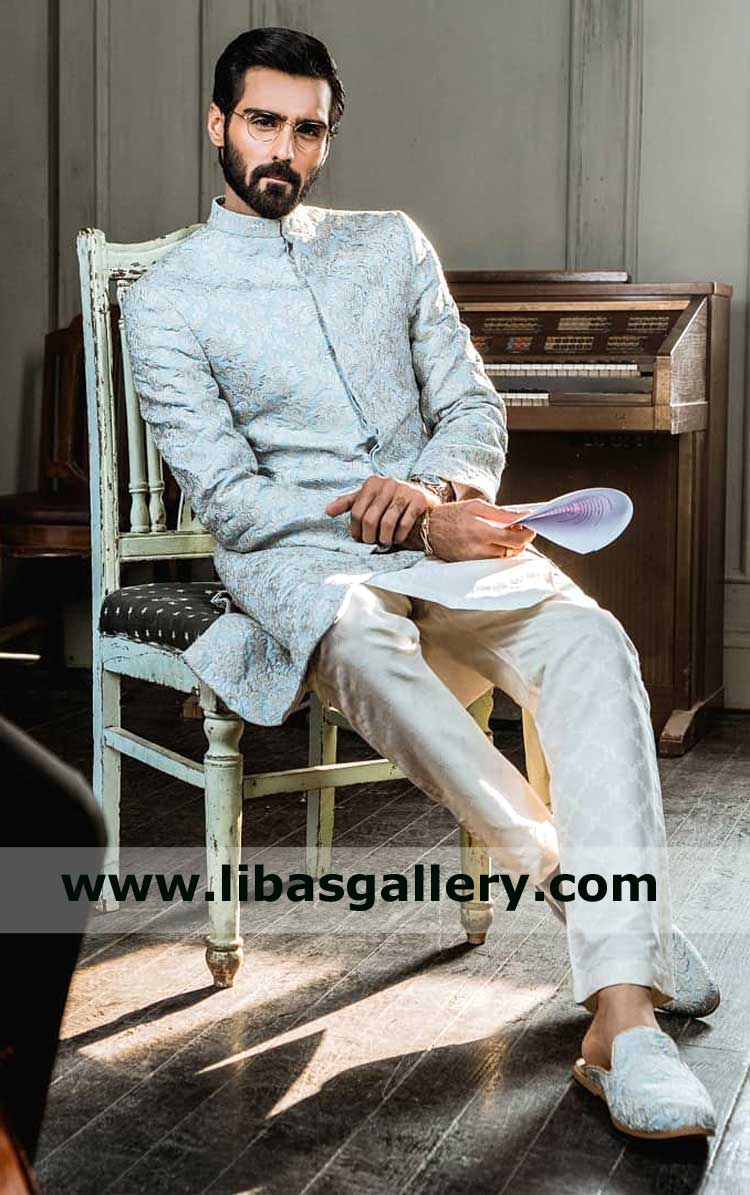 Men Bespoke Embroidered Classic Style Sherwani Suit Hasnain Lehri wearing sitting on chair reading paper Kansas City Olathe Sioux Falls USA