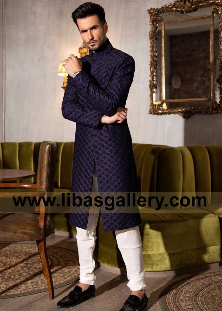 Deep Blue captivating pintucked sherwani suit the art of meticulous craftsmanship by Artisans paired with white Trouser London California Dubai Perth