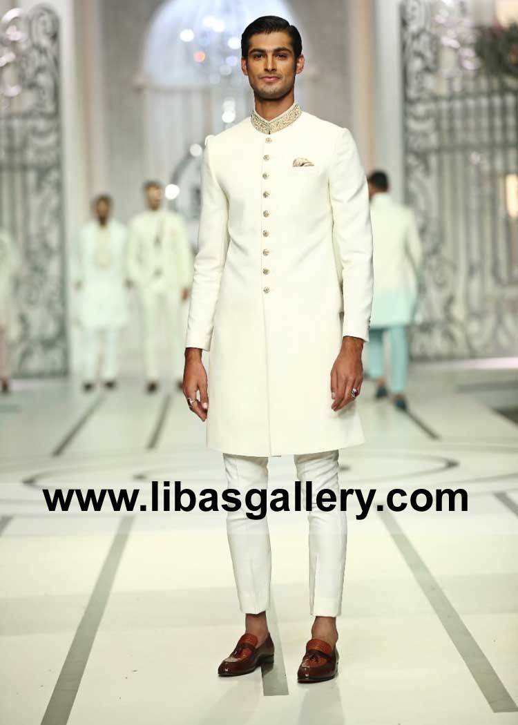 white sherwani made on Italian suiting fabric  with kora dabka hand embellished collar paired with inner kurta pajama UK USA Canada Australia Dubai