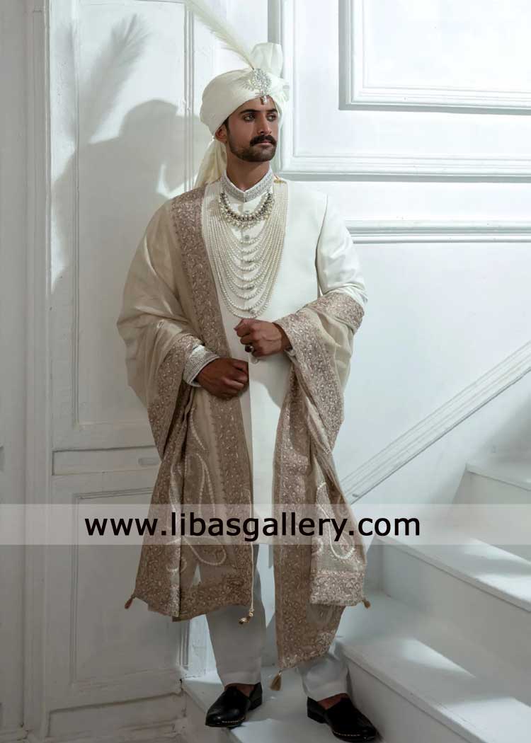 white groom raw silk sherwani for refined romance on nikah with elegant hand work collar cuff paired shawl Phoenix San Diego Manchester Dubai white groom raw silk sherwani for refined romance on nikah with elegant hand work collar cuff paired shawl Phoenix San Diego Manchester Dubai